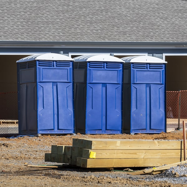 what is the cost difference between standard and deluxe portable restroom rentals in Corry